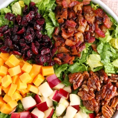 A cozy autumn chopped salad with seasonal vegetables and nuts.