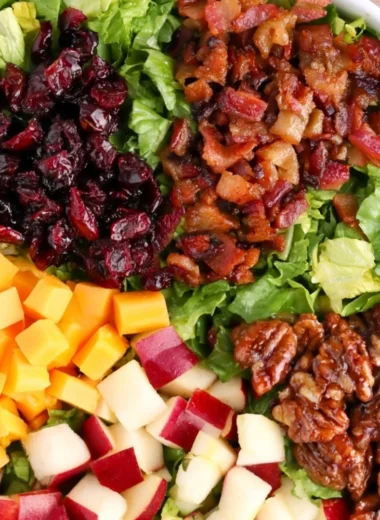A cozy autumn chopped salad with seasonal vegetables and nuts.