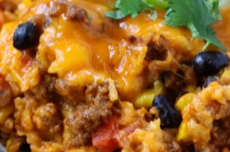 Delicious beef enchilada casserole layered with rice and savory toppings.