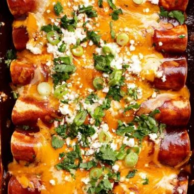 Delicious black bean enchiladas topped with cheese and fresh cilantro