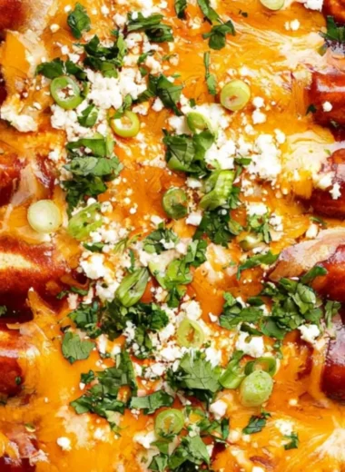 Delicious black bean enchiladas topped with cheese and fresh cilantro