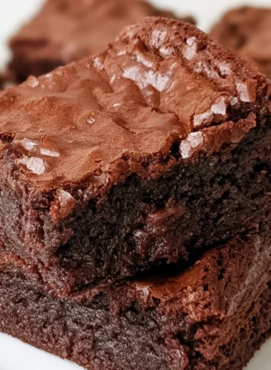 Delicious homemade brownies on a plate, made from a cozy classic brownie recipe.