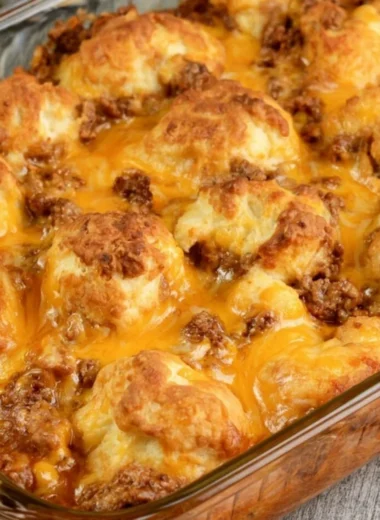 Cozy Sloppy Joe Biscuit Casserole topped with flaky biscuits
