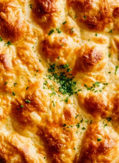 Dutch Oven Chicken Pot Pie with golden crust and hearty filling