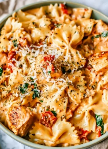 Delicious Marry Me Chicken Pasta served on a plate with herbs and toppings.