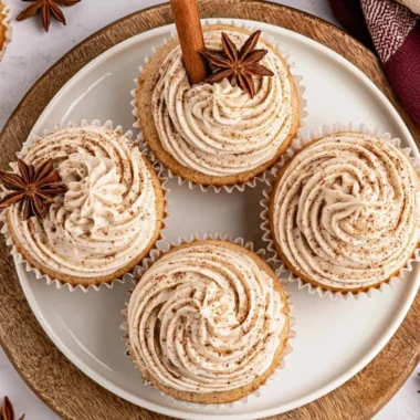 Spiced chai latte cupcakes topped with cream and spices